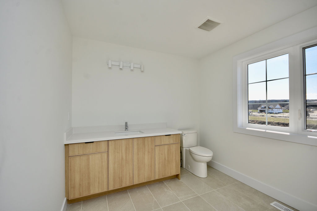 Upstairs bathroom vanity with loads of counter space.