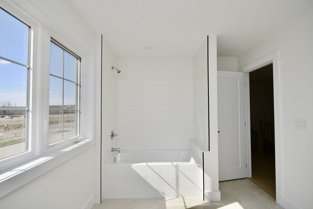 Upstairs bathroom tub and shower combo.