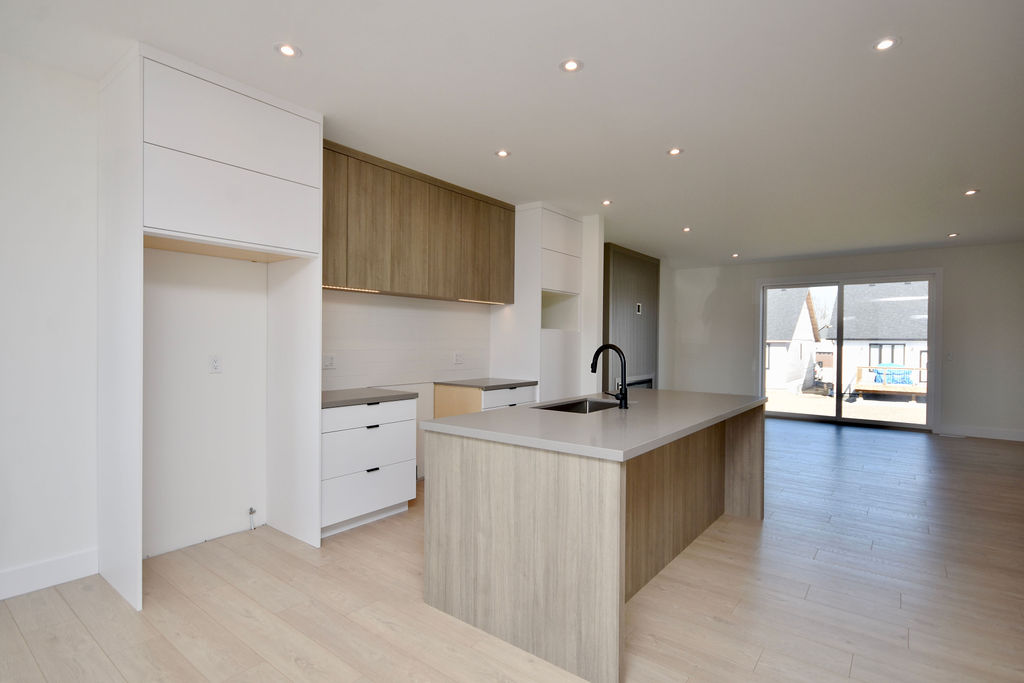 View of the open kitchen with a large island.